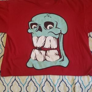 Vans red with a skull print tee-shirt.    Size L